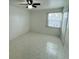 Bedroom featuring tile floors, a ceiling fan with lighting, and a window at 2751 L B Mcleod Rd # 2751, Orlando, FL 32805