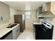 Updated kitchen with stainless steel appliances and gray cabinets at 2751 L B Mcleod Rd # 2751, Orlando, FL 32805