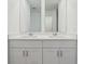 Bathroom features double sink vanity with white cabinets and quartz countertop at 2933 Wild Olive Dr, St Cloud, FL 34772