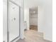 Bathroom featuring a glass-enclosed shower and a view into the walk-in closet at 2933 Wild Olive Dr, St Cloud, FL 34772