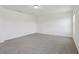 Spacious bedroom boasts neutral carpet, white walls, and modern ceiling light at 2933 Wild Olive Dr, St Cloud, FL 34772