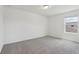 A serene bedroom with soft carpet, a bright window, and ample natural light at 2933 Wild Olive Dr, St Cloud, FL 34772