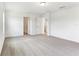 Spacious bedroom featuring neutral carpet, white walls, and doorway to other areas of the home at 2933 Wild Olive Dr, St Cloud, FL 34772