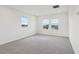 Spacious bedroom with plush carpet and windows that provide plenty of natural light at 2933 Wild Olive Dr, St Cloud, FL 34772