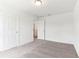 Bedroom features plush carpeting and closet at 2933 Wild Olive Dr, St Cloud, FL 34772