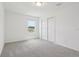 Bedroom featuring neutral carpet, a window with natural light, and a closet at 2933 Wild Olive Dr, St Cloud, FL 34772