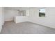 Upstairs bonus room with carpeting, white walls, and a window at 2933 Wild Olive Dr, St Cloud, FL 34772
