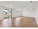 Open-concept living room featuring tile floors, recessed lighting, and sliding glass doors to the backyard at 2933 Wild Olive Dr, St Cloud, FL 34772