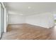 Large living room featuring wood-look tile floors and white walls with great natural light at 2933 Wild Olive Dr, St Cloud, FL 34772