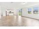 Open-concept living space with tile flooring and a view to the kitchen at 2933 Wild Olive Dr, St Cloud, FL 34772