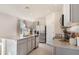 View of the kitchen featuring a granite island, stainless steel appliances, and light gray cabinets at 3182 Partington Blvd, Davenport, FL 33837