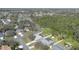Scenic aerial view highlighting the property's desirable location and expansive backyard, complemented by mature trees at 3275 Deer Lick Ct, Kissimmee, FL 34746