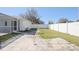 Large backyard featuring white privacy fence and a paver patio at 3275 Deer Lick Ct, Kissimmee, FL 34746