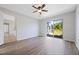 Bedroom featuring wood floors and sliding doors to the yard at 3275 Deer Lick Ct, Kissimmee, FL 34746