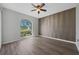 Bedroom featuring a large window and unique accent wall at 3275 Deer Lick Ct, Kissimmee, FL 34746