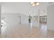Spacious living room featuring tile flooring, an open layout, and ample natural light, perfect for entertaining at 3275 Deer Lick Ct, Kissimmee, FL 34746