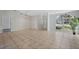 Bright living room boasts neutral walls, tiled floors, and large windows, creating a comfortable atmosphere at 3275 Deer Lick Ct, Kissimmee, FL 34746