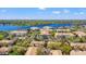 Scenic aerial view of a neighborhood and lake community featuring multiple buildings and lush landscapes at 3332 Robert Trent Jones Dr # 20703, Orlando, FL 32835