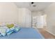 Bedroom with closet and bathroom. The bed is neatly arranged with colorful pillows at 3332 Robert Trent Jones Dr # 20703, Orlando, FL 32835