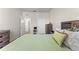 Bright bedroom featuring a bed and access to closet and bathroom at 3332 Robert Trent Jones Dr # 20703, Orlando, FL 32835