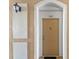 Condo front door with doorbell and light fixture; door number 207 at 3332 Robert Trent Jones Dr # 20703, Orlando, FL 32835