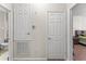 Functional hallway with closet, thermostat, and doors leading to a bathroom and a bedroom at 3332 Robert Trent Jones Dr # 20703, Orlando, FL 32835