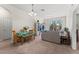 View of condo living room with dining table and television cabinet at 3332 Robert Trent Jones Dr # 20703, Orlando, FL 32835