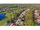 Aerial view features a landscaped home near golf course, offering serene views and outdoor amenities at 3352 Park Grove Ct, Longwood, FL 32779