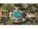 Aerial view showcases the community pool, outdoor seating, and surrounding landscaping at 3352 Park Grove Ct, Longwood, FL 32779