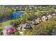 Aerial shot of luxury homes near a golf course, featuring a serene pond and verdant landscape at 3352 Park Grove Ct, Longwood, FL 32779
