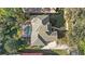 An aerial view showcases the backyard pool, lush landscaping, and roof of the house at 3352 Park Grove Ct, Longwood, FL 32779