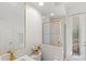 Bathroom featuring a vanity with a gold framed mirror, a glass enclosed shower, and a door to the outside at 3352 Park Grove Ct, Longwood, FL 32779