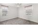 Bedroom with carpet, bright white walls, two windows and neutral colored blinds at 3352 Park Grove Ct, Longwood, FL 32779