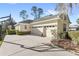 View of the driveway leading to the three-car garage of the house at 3352 Park Grove Ct, Longwood, FL 32779