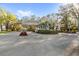 Entrance to the gated community with landscaping and trees at 3352 Park Grove Ct, Longwood, FL 32779