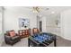 Spacious game room with foosball table, comfortable seating, and stylish decor with modern fixtures at 3352 Park Grove Ct, Longwood, FL 32779