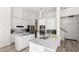 Modern kitchen with white cabinets, stainless steel appliances, and a spacious center island at 3352 Park Grove Ct, Longwood, FL 32779