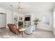 Bright living room with ceiling fan, luxury vinyl floors, and a fireplace framed by built-in shelving at 3352 Park Grove Ct, Longwood, FL 32779