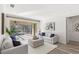 Bright living room with neutral decor, plush seating, and a view of the outdoor pool at 3352 Park Grove Ct, Longwood, FL 32779