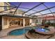 Beautiful backyard featuring a pool, spa, covered patio, and lush landscaping, ideal for outdoor living at 3352 Park Grove Ct, Longwood, FL 32779