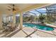 Inviting screened-in pool and spa with an outdoor dining area on a brick patio, ideal for leisure at 3352 Park Grove Ct, Longwood, FL 32779