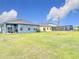 Expansive backyard with lush green grass, ideal for outdoor activities, and relaxing in the neighborhood at 338 Crestwind Dr, Daytona Beach, FL 32124