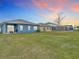 Expansive backyard with lush lawn, ideal for outdoor activities and entertaining at 338 Crestwind Dr, Daytona Beach, FL 32124