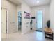 Bright foyer with tile flooring, featuring an entryway table and views of the hallway at 338 Crestwind Dr, Daytona Beach, FL 32124