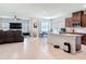 Bright, open-concept kitchen flows into living space, featuring a large island and modern appliances at 338 Crestwind Dr, Daytona Beach, FL 32124