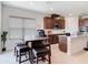 Well-equipped kitchen featuring wooden cabinets, granite countertops, and a convenient center island with seating at 338 Crestwind Dr, Daytona Beach, FL 32124