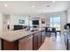 Spacious kitchen with granite countertops, stainless steel appliances, and open-concept design at 338 Crestwind Dr, Daytona Beach, FL 32124