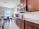 Well-equipped kitchen with granite countertops, stainless appliances, and ample cabinet space at 338 Crestwind Dr, Daytona Beach, FL 32124