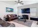 Relaxing living room with plush leather seating and a large flat screen television at 338 Crestwind Dr, Daytona Beach, FL 32124