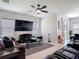 Inviting living room features a large TV, comfortable seating, and a view of the breakfast nook at 338 Crestwind Dr, Daytona Beach, FL 32124
